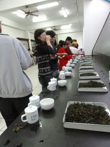 Everyone tasting the teas. Along with tasting the brewed liquid, we were encouraged to pick up the capped mugs and sniff the leaves inside.